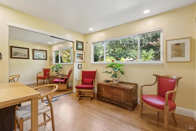 a patio with a fountain table and chairs