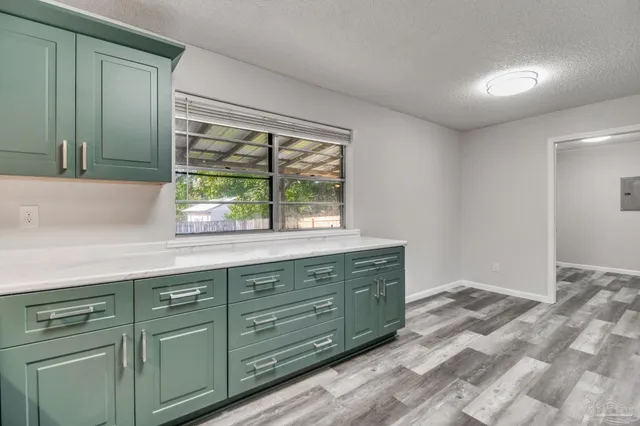 a room with a bed and a cabinets