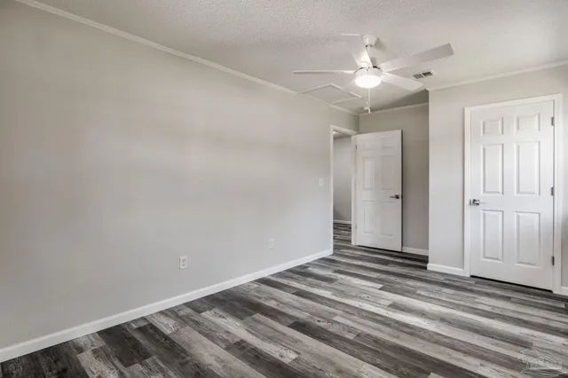 a view of a room with wooden floor