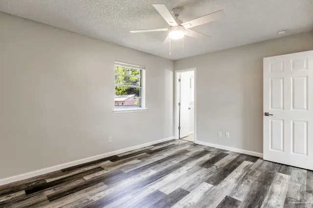 a bathroom with a bathtub and a toilet