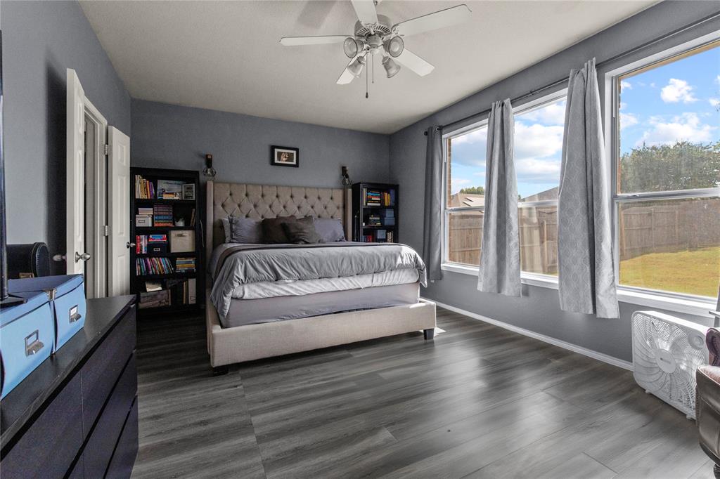 4100 Chisos Rim Trail Fort Worth, TX 76244 - Photo 12 of 30 a spacious bedroom with a large bed and a large window
