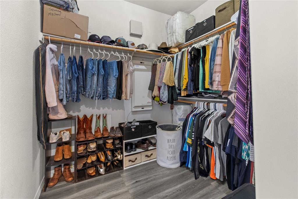 4100 Chisos Rim Trail Fort Worth, TX 76244 - Photo 17 of 30 a view of walk in closet with clothes and shoes