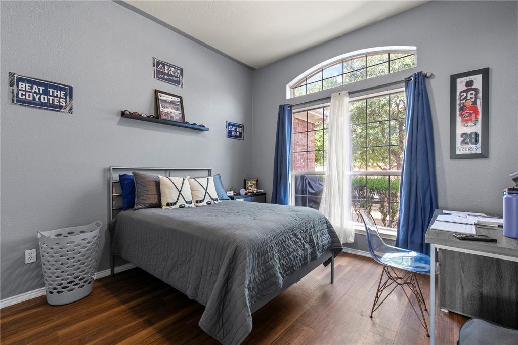 4100 Chisos Rim Trail Fort Worth, TX 76244 - Photo 18 of 30 a bedroom with a bed and a window