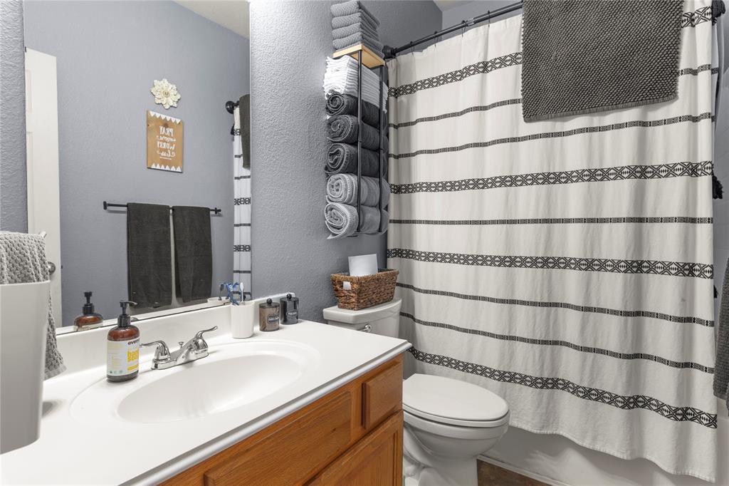 4100 Chisos Rim Trail Fort Worth, TX 76244 - Photo 20 of 30 a bathroom with a sink toilet and shower