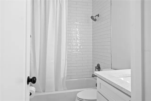 a bathroom with a sink a toilet and a bathtub