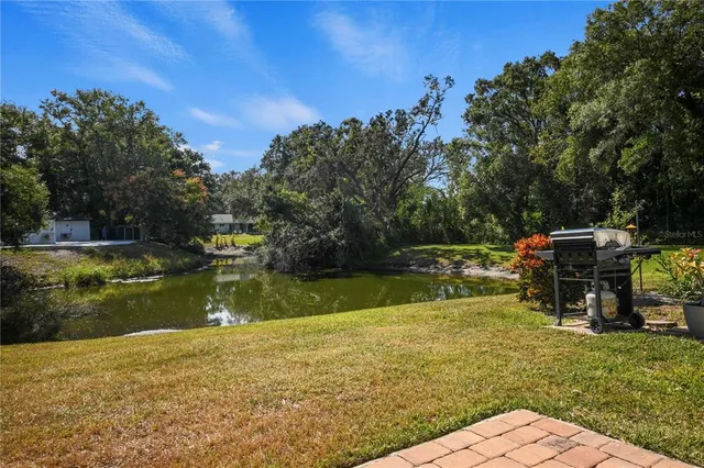 a view of swimming pool with a yard