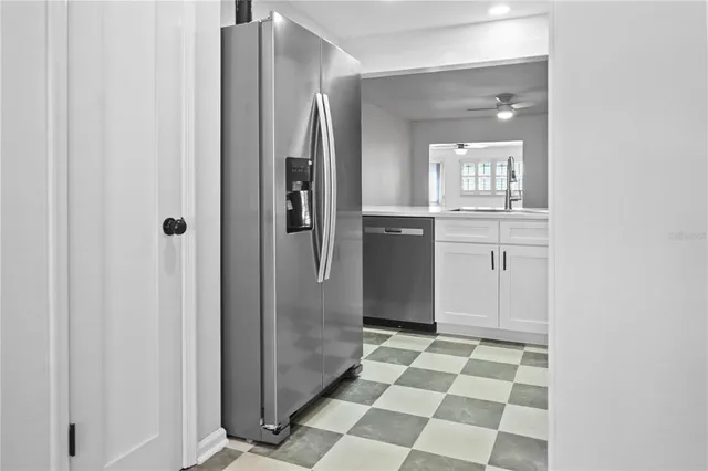 a bathroom with a glass door shower and a sink
