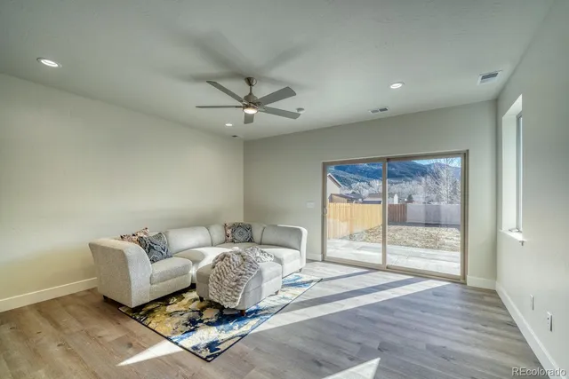 a bathroom with a sink vanity mirror and toilet