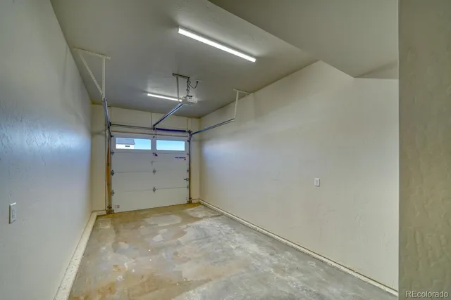 a view of a livingroom with a ceiling fan and window