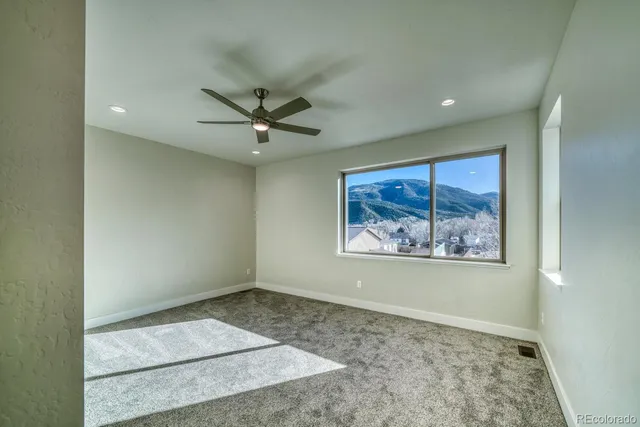 a view of a hallway with a window