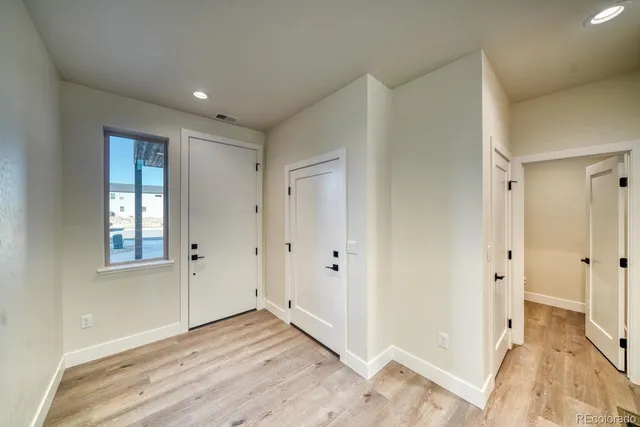a view of entryway with wooden floor