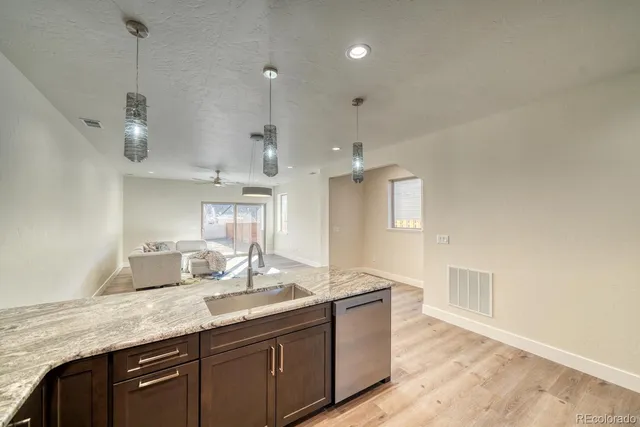 a bathroom with double vanity and a mirror