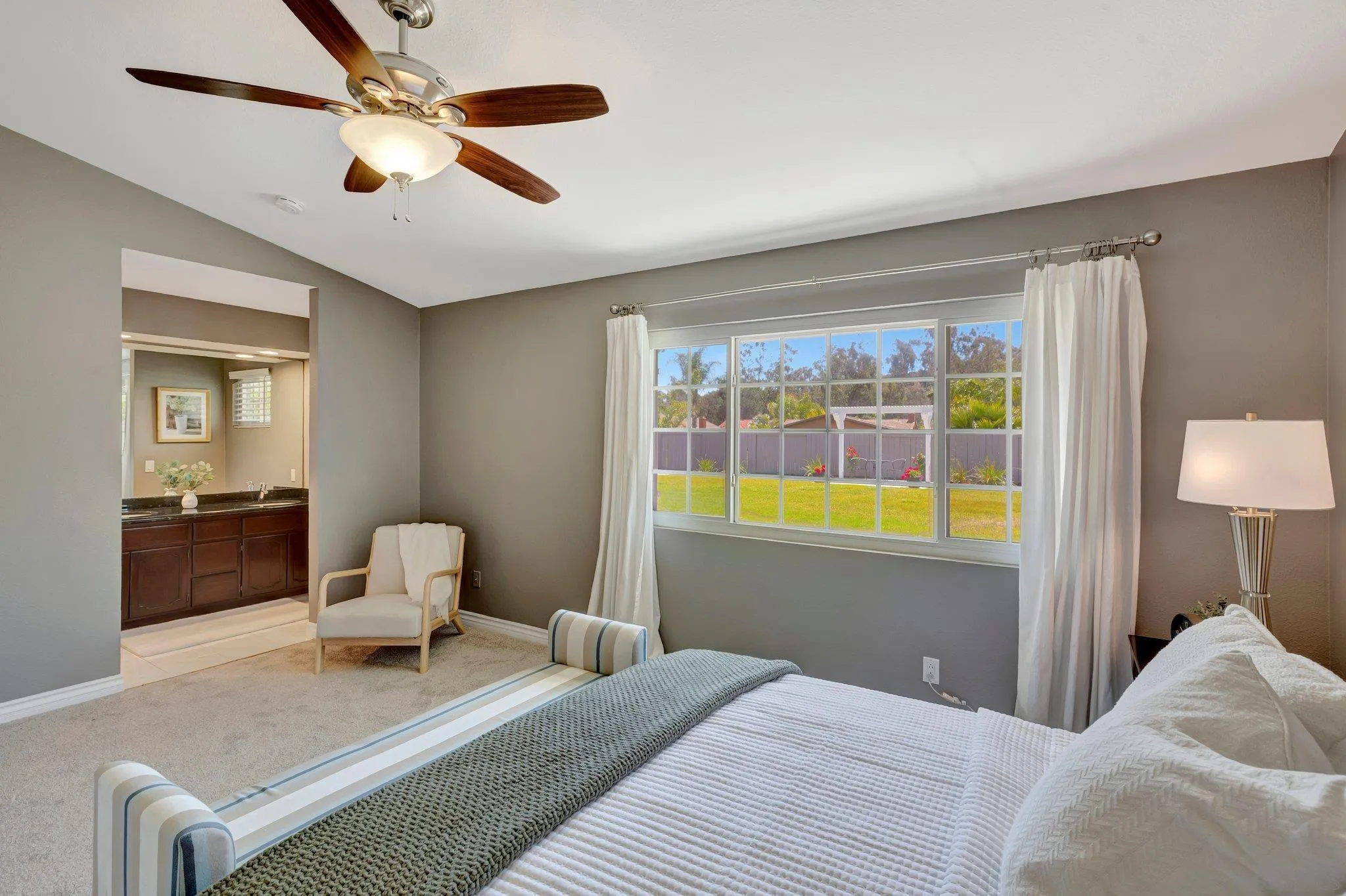 13057 Triumph Drive Poway, CA 92064 - Photo 12 of 31 a bedroom with a bed and wooden floor
