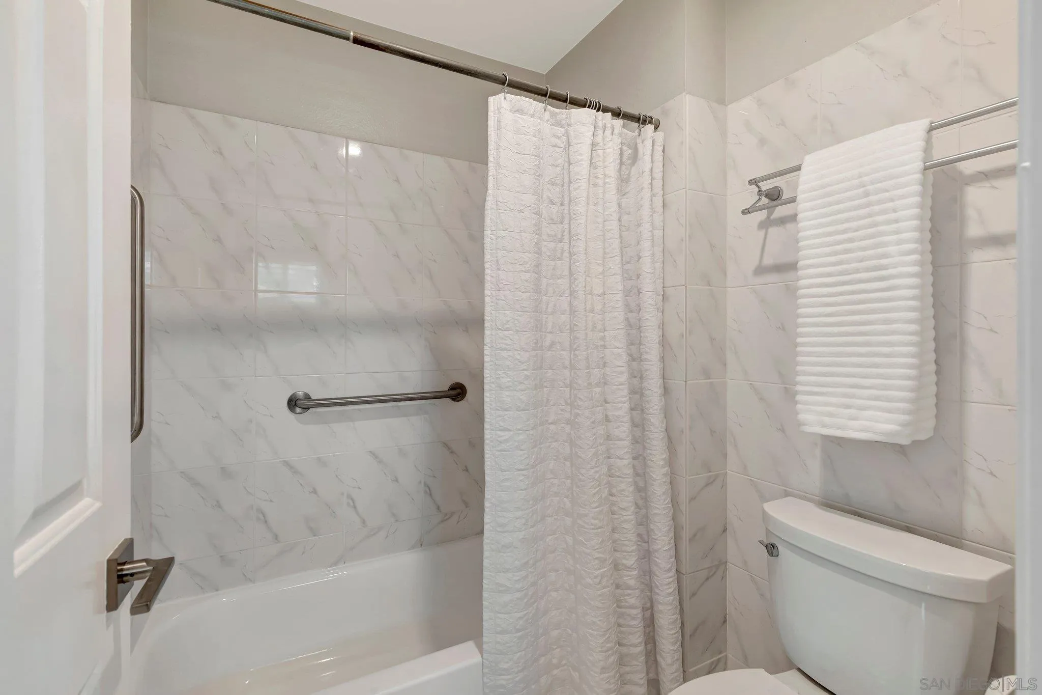 13057 Triumph Drive Poway, CA 92064 - Photo 19 of 31 a bathroom with a shower and a toilet