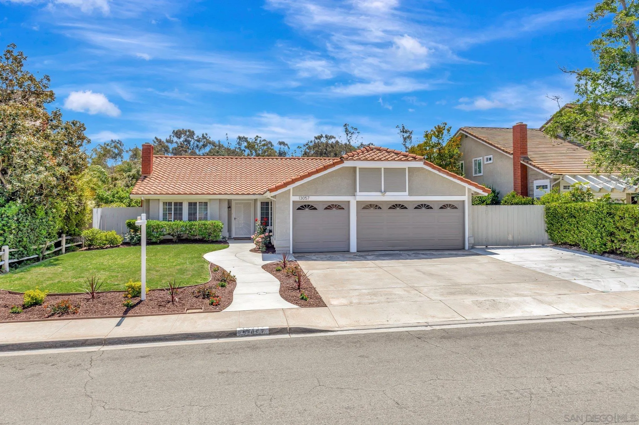 13057 Triumph Drive Poway, CA 92064 - Photo 3 of 31 a view of a white house with a yard and large tree