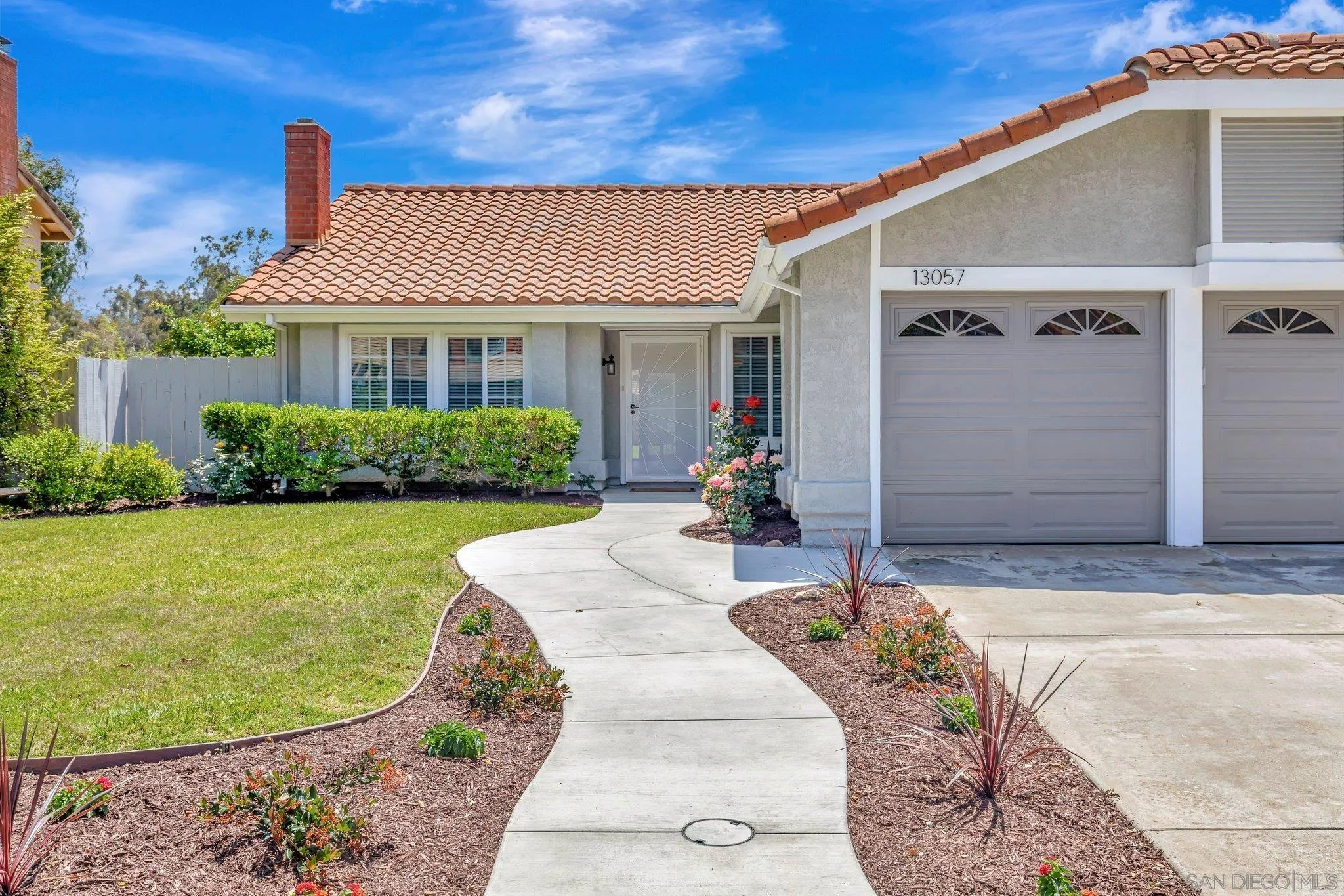 13057 Triumph Drive Poway, CA 92064 - Photo 4 of 31 a front view of a house with garden