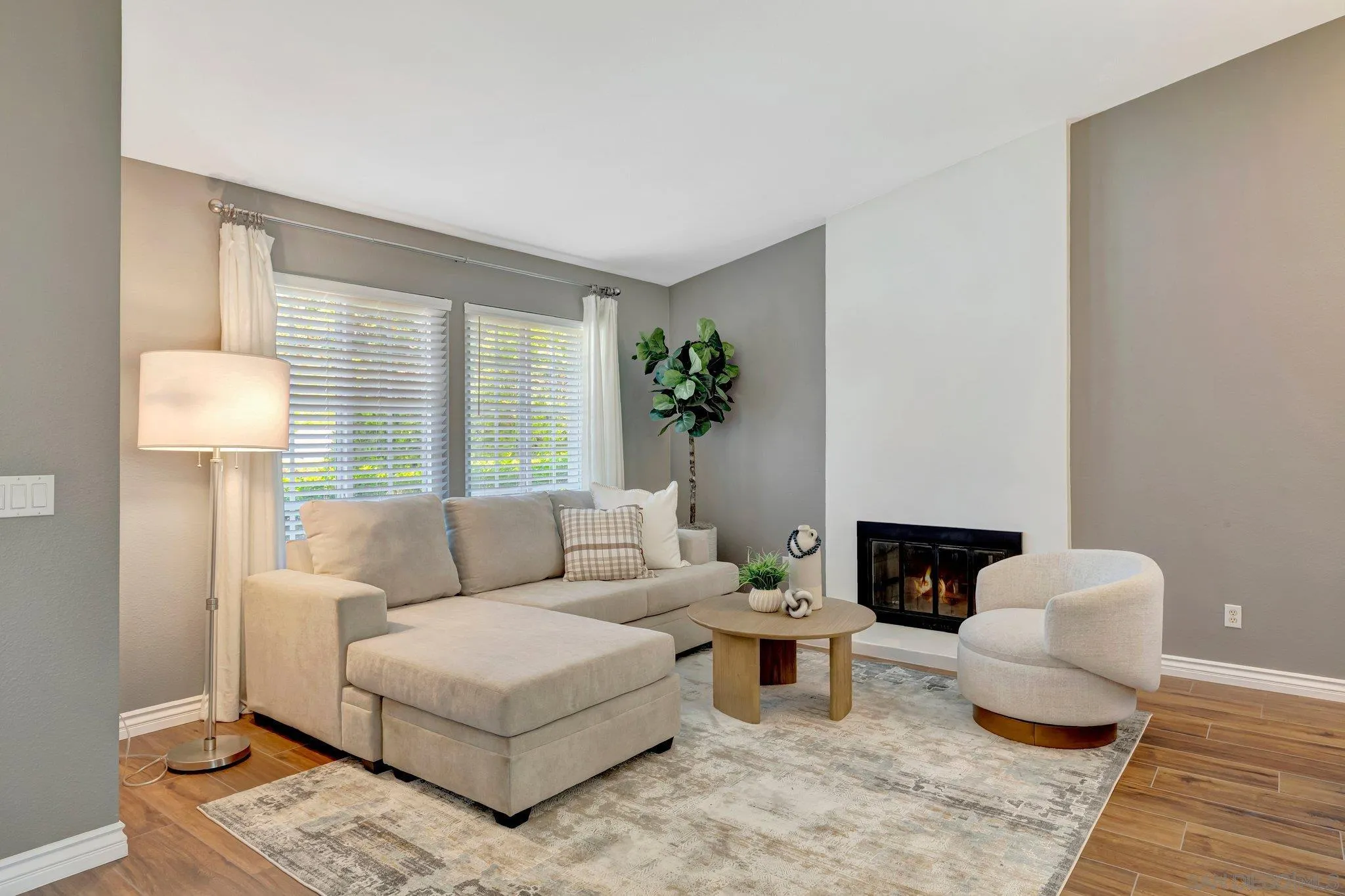 13057 Triumph Drive Poway, CA 92064 - Photo 6 of 31 a living room with furniture and a fireplace