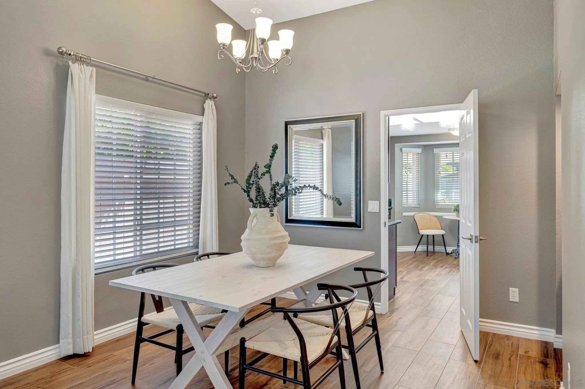 13057 Triumph Drive Poway, CA 92064 - Photo 7 of 31 a view of a dining room with furniture and wooden floor