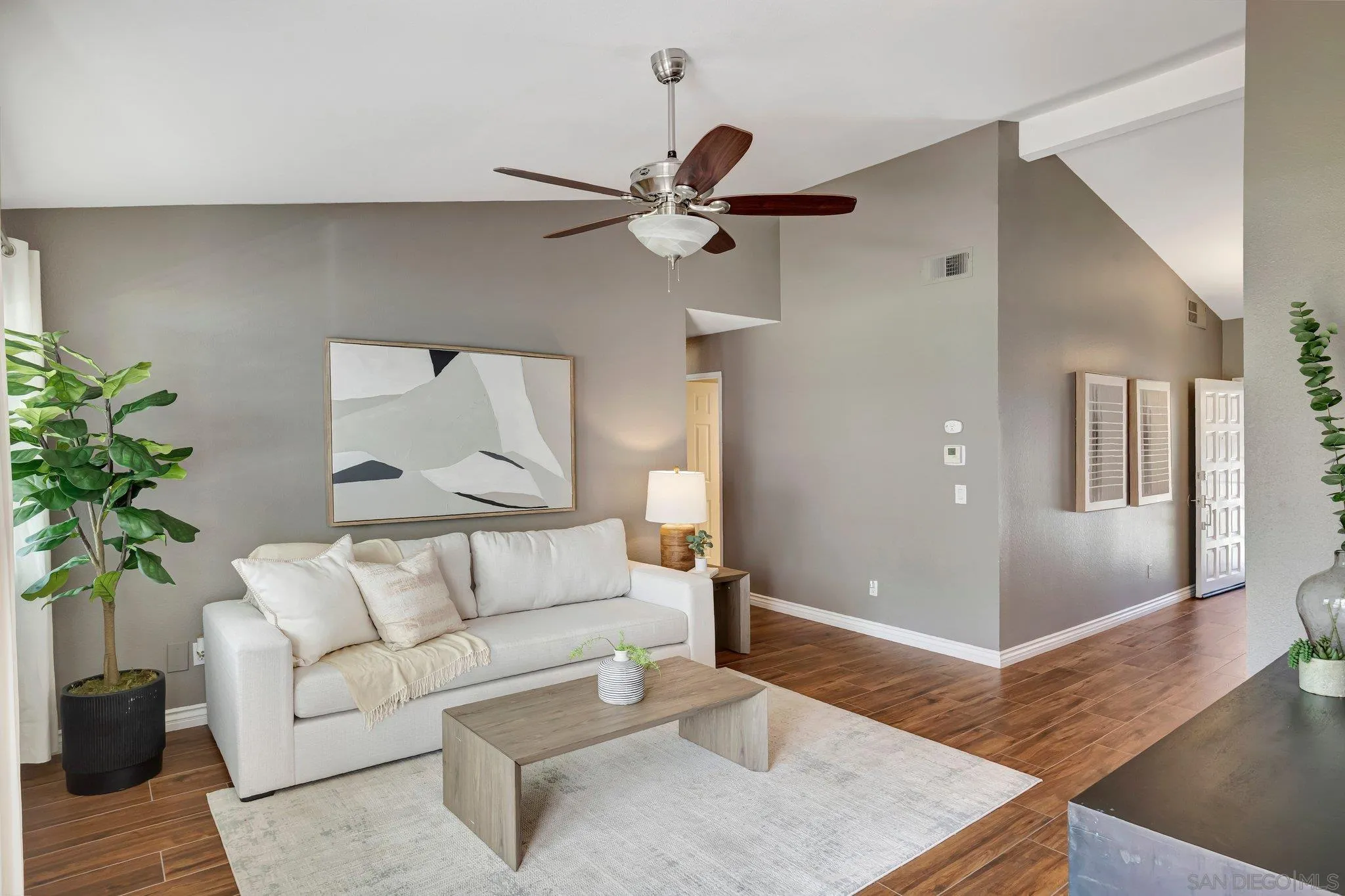 13057 Triumph Drive Poway, CA 92064 - Photo 8 of 31 a living room with furniture and a potted plant