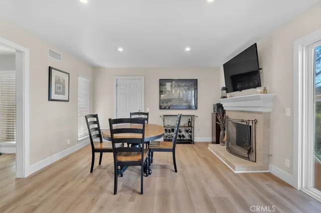 a view of a livingroom with furniture and a fireplace