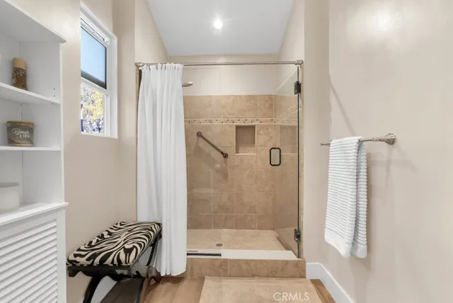 a bathroom with a bathtub and a shower