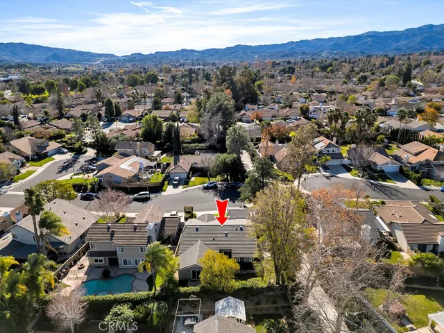 an aerial view of a house with outdoor space