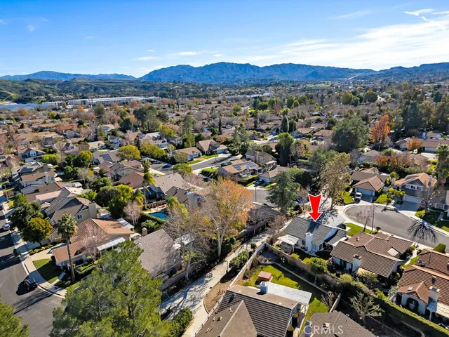 a view of a house with backyard sitting area and garden