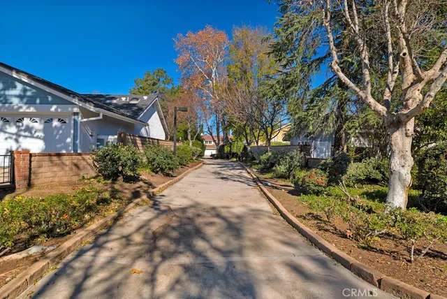a view of a backyard with sitting area