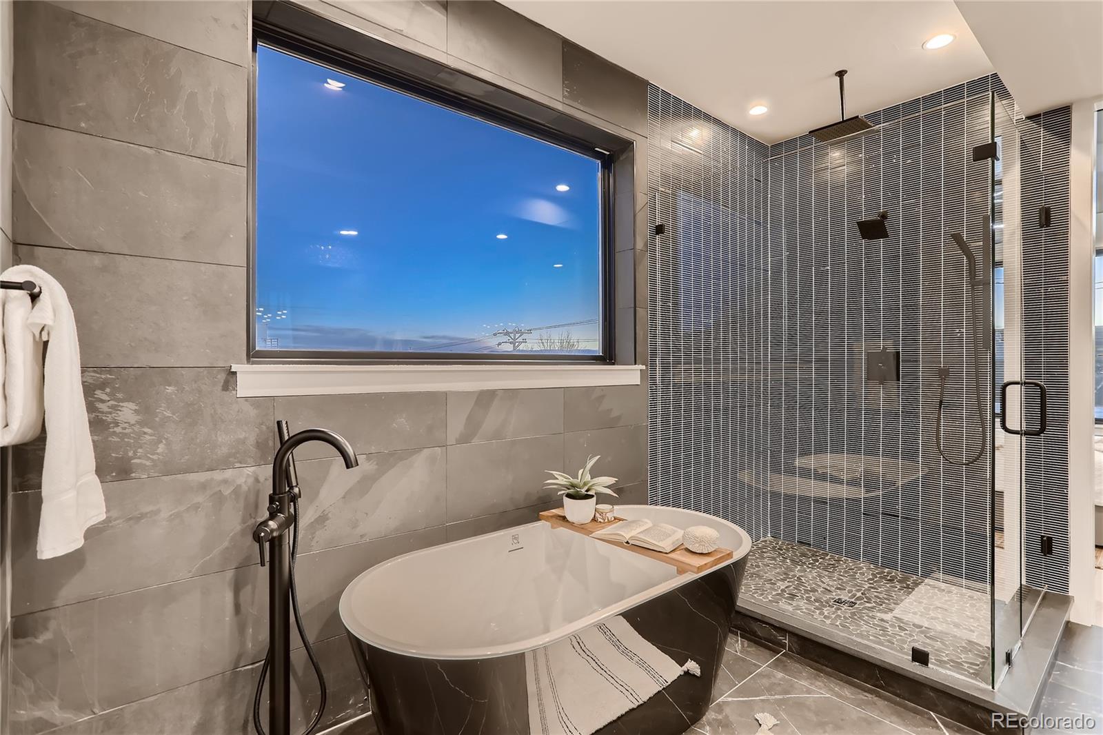 29 Harrison Street Denver, CO 80206 - Photo 16 of 40 a bathroom with a sink shower and a mirror