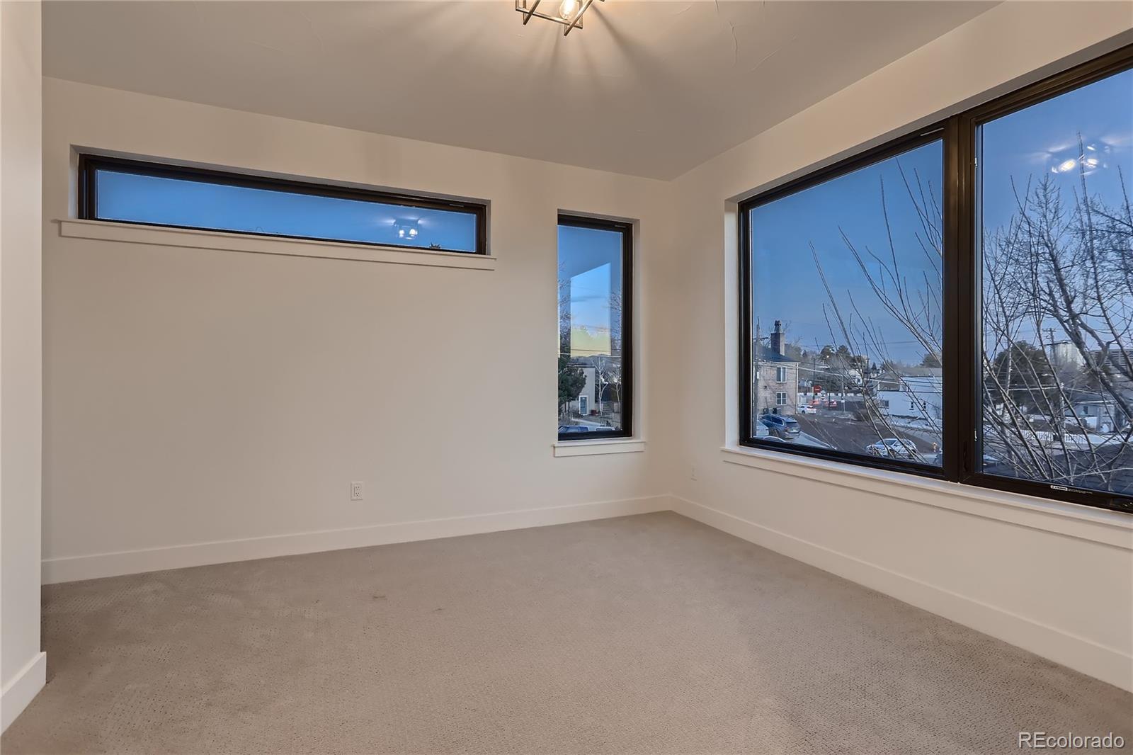 29 Harrison Street Denver, CO 80206 - Photo 18 of 40 a view of an empty room with a window