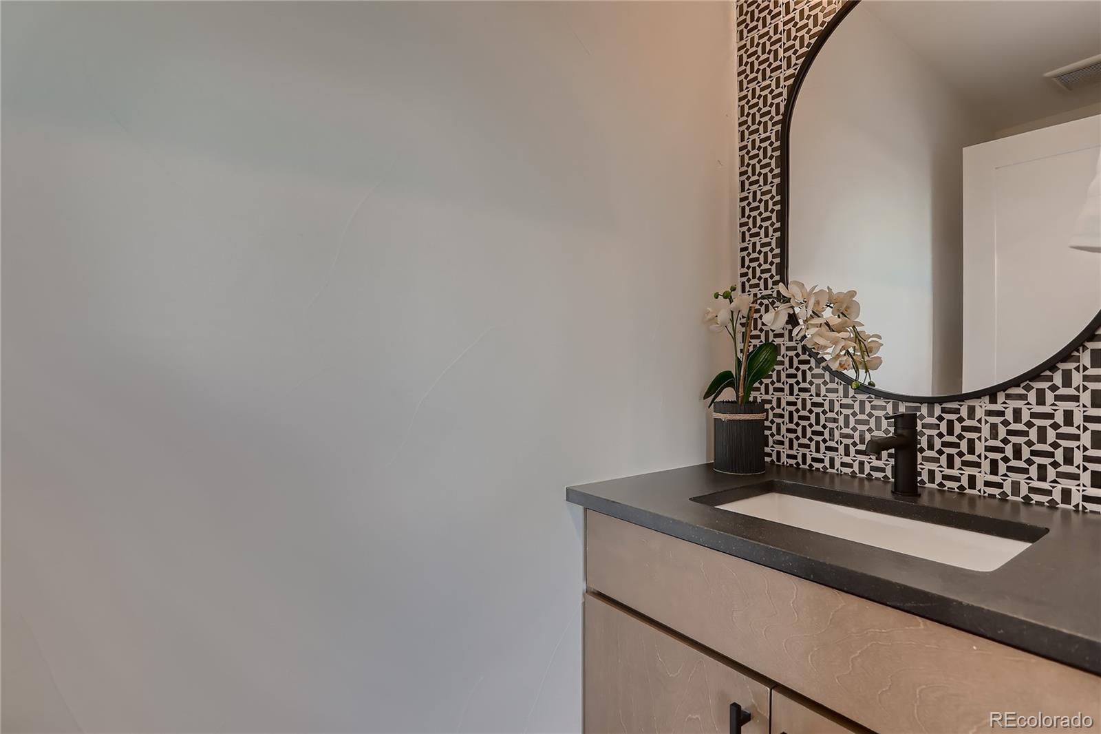 29 Harrison Street Denver, CO 80206 - Photo 20 of 40 a view of staircase with mirror