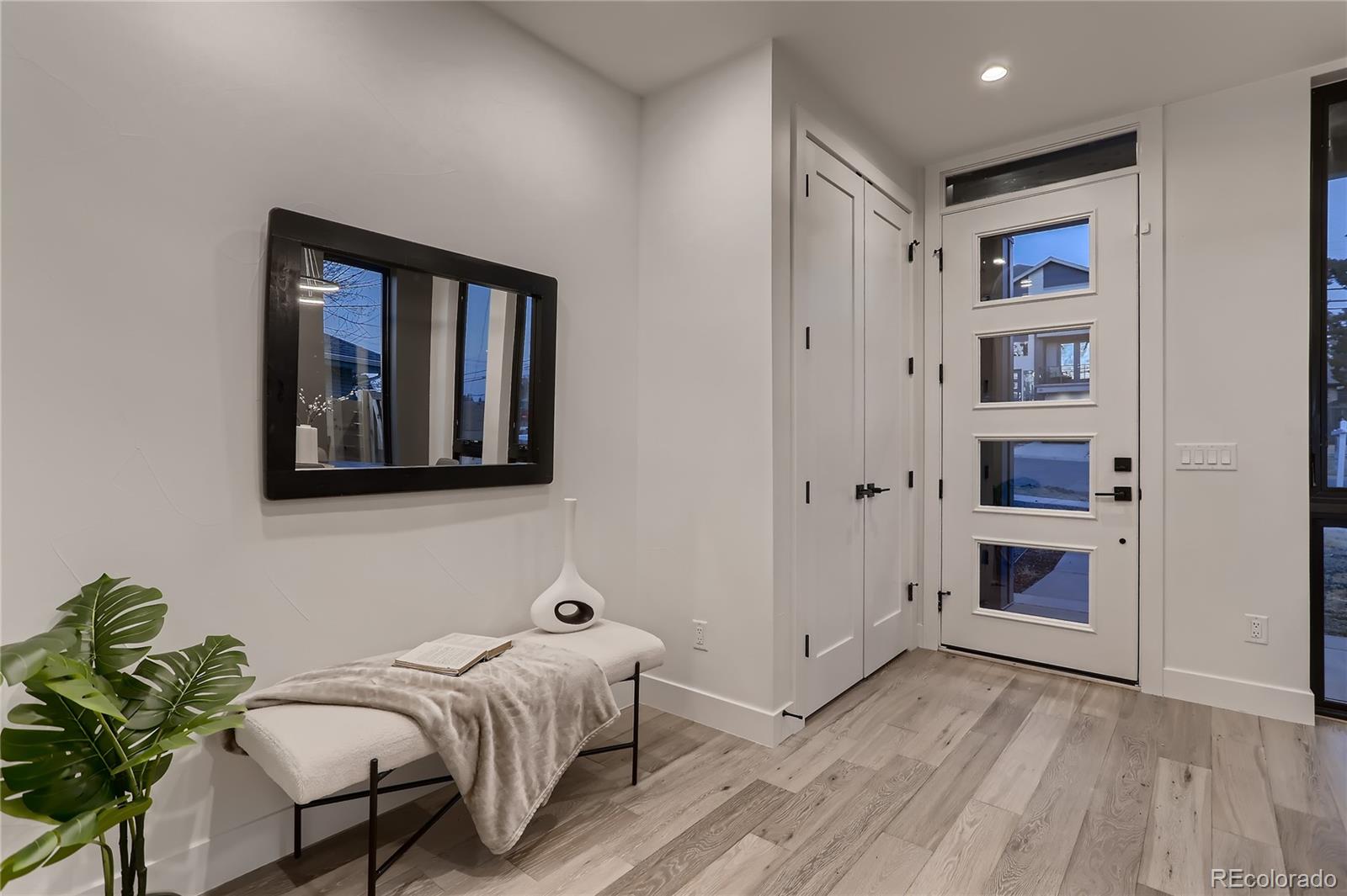 29 Harrison Street Denver, CO 80206 - Photo 2 of 40 a bedroom with bed and a window