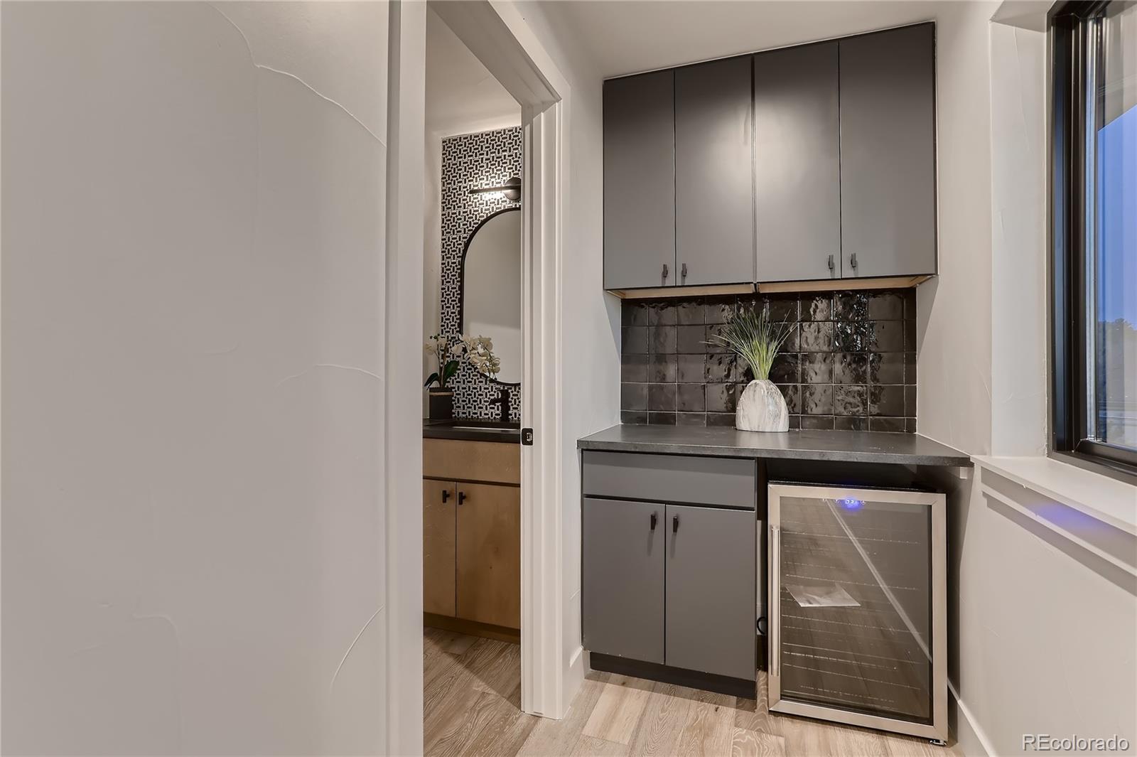 29 Harrison Street Denver, CO 80206 - Photo 21 of 40 a kitchen with a sink and cabinets
