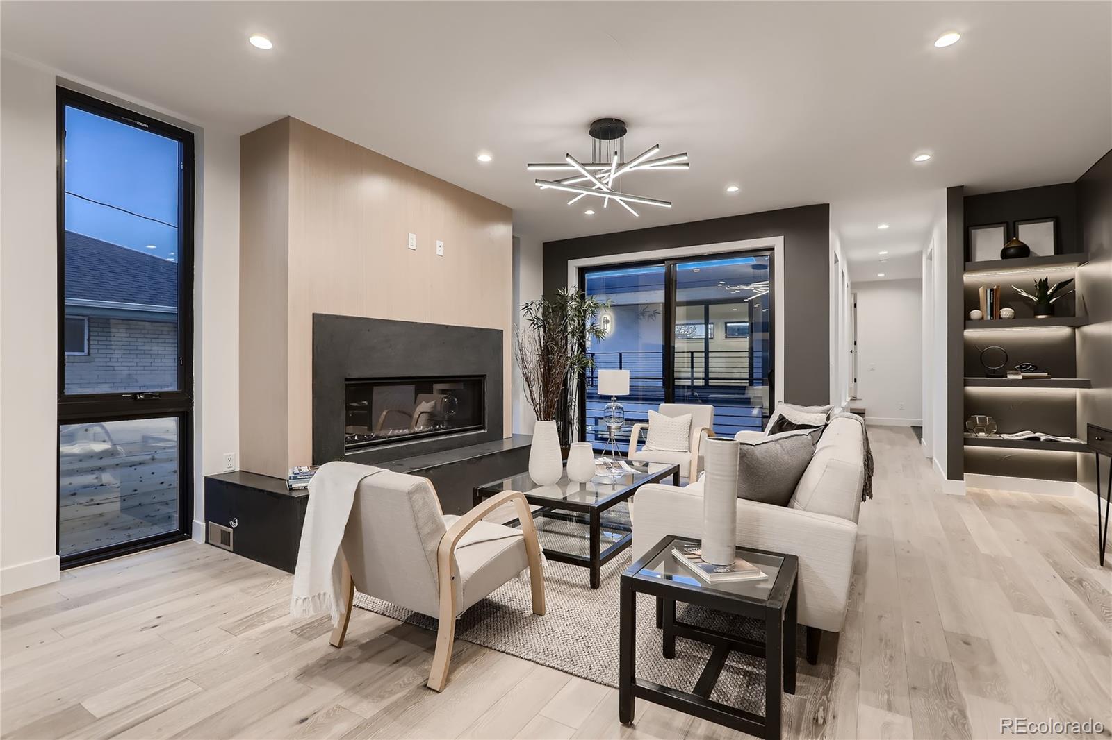 29 Harrison Street Denver, CO 80206 - Photo 3 of 40 a living room with furniture and a flat screen tv