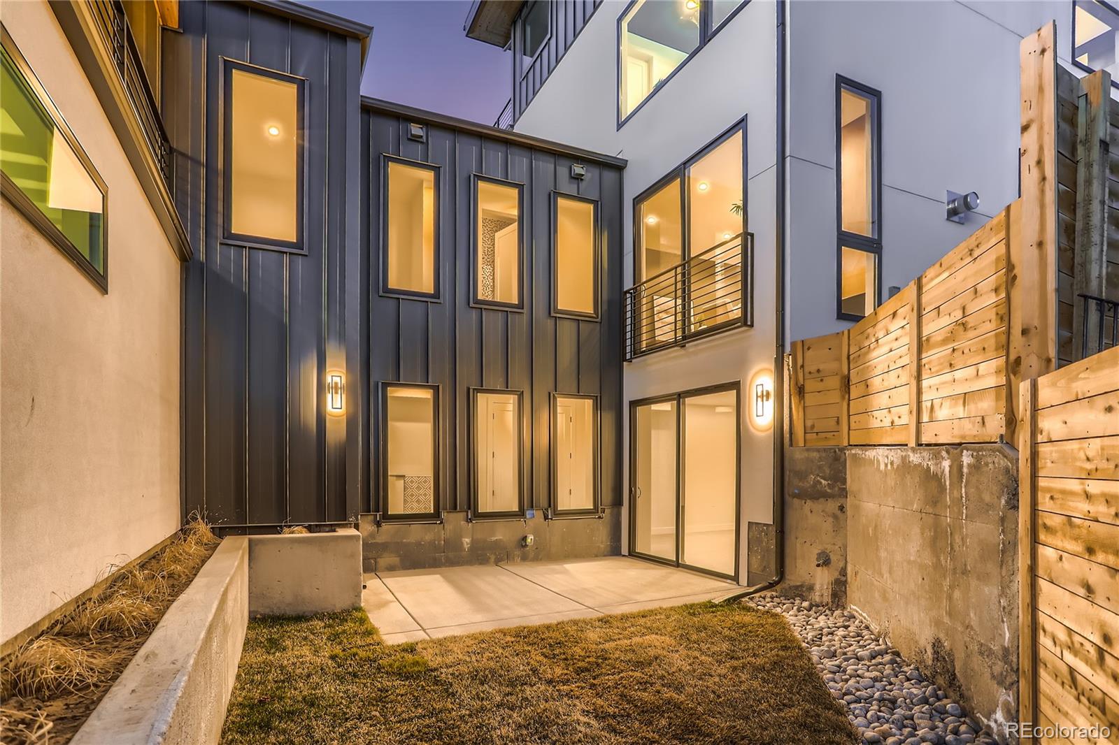 29 Harrison Street Denver, CO 80206 - Photo 35 of 40 a bedroom with a bed and a window