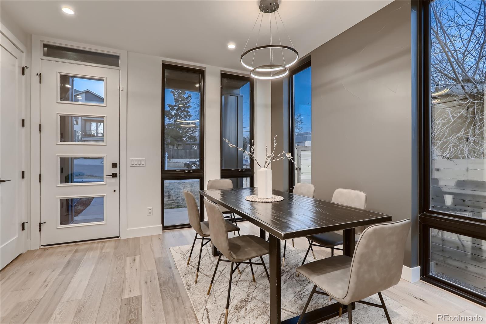 29 Harrison Street Denver, CO 80206 - Photo 5 of 40 a view of a dining room with furniture and wooden floor