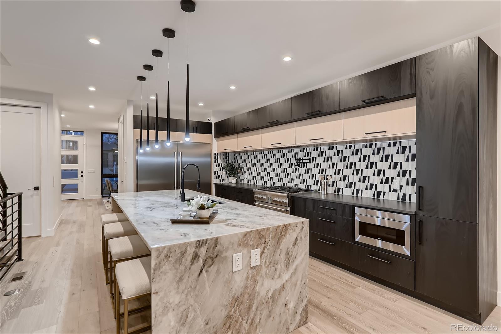 29 Harrison Street Denver, CO 80206 - Photo 8 of 40 a kitchen with a sink appliances and cabinets