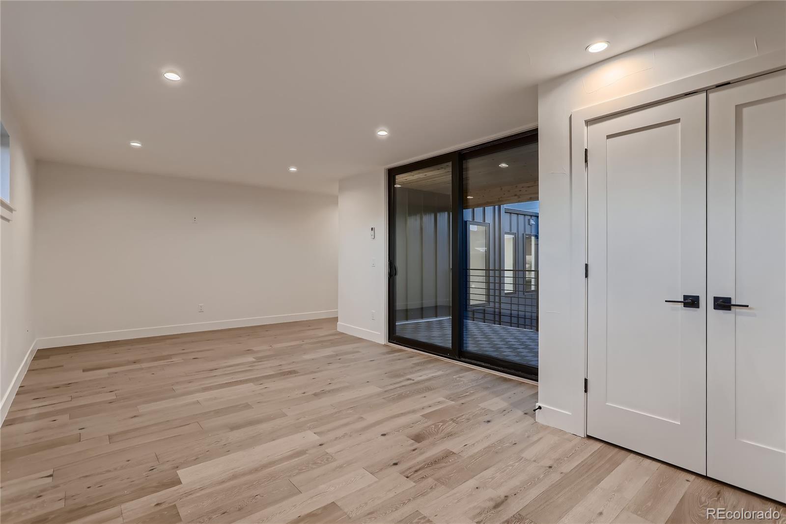 29 Harrison Street Denver, CO 80206 - Photo 10 of 40 wooden floor in an empty room with wooden floor