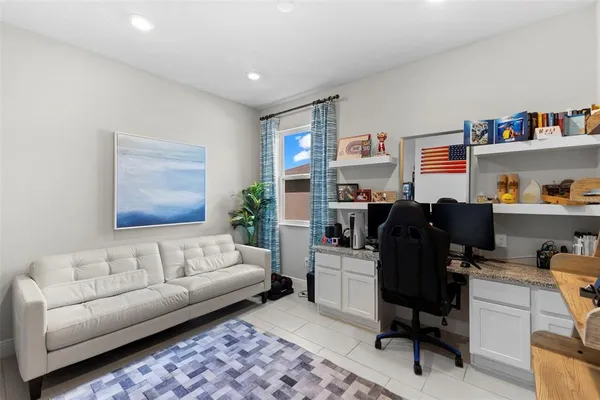 a living room with furniture and a couch