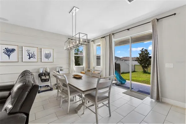 a view of a dining room with furniture window and outside view