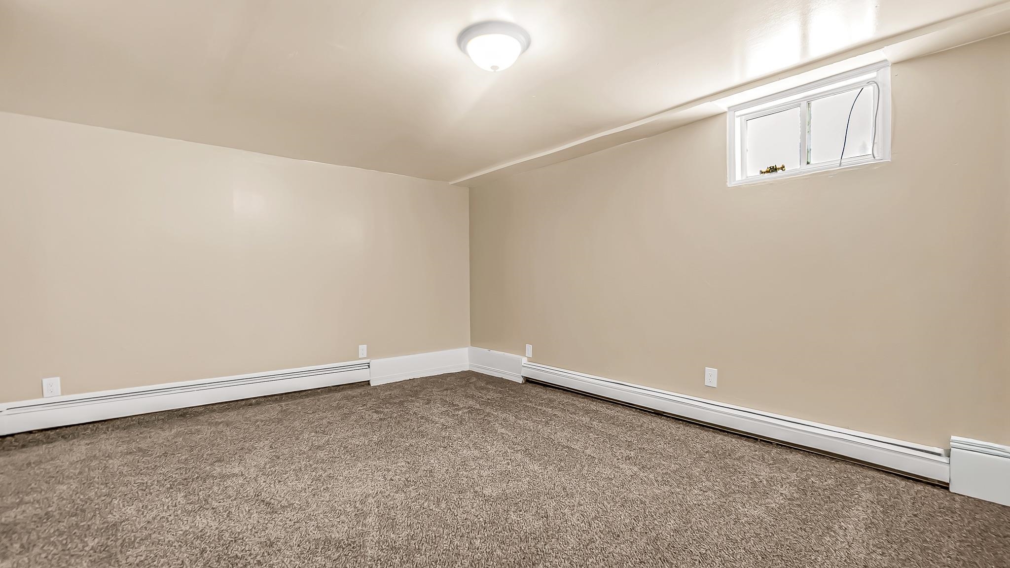 208 3rd Street Parachute, CO 81635 - Photo 21 of 40 an empty room with an entryway