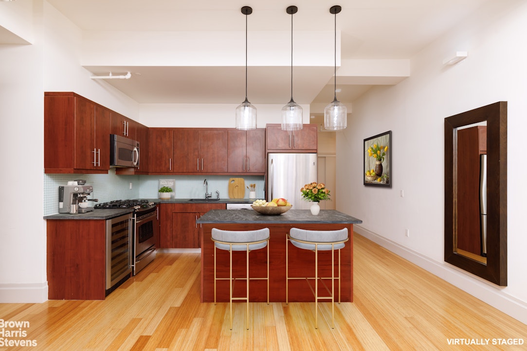 365 Bridge Street, Unit 3M Brooklyn, NY 11201 - Photo 2 of 12 a kitchen with stainless steel appliances granite countertop wooden floors a stove a sink a dining table and chairs