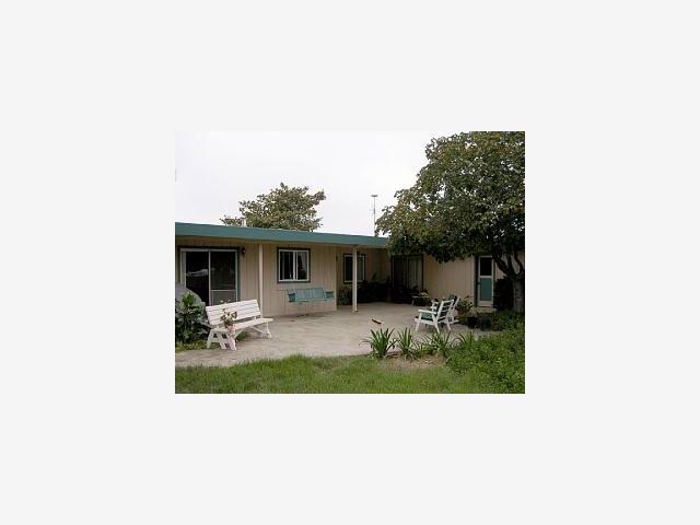 40 Peckham Road Watsonville, CA 95076 - Photo 1 of 1 a view of a house with backyard sitting area and garden