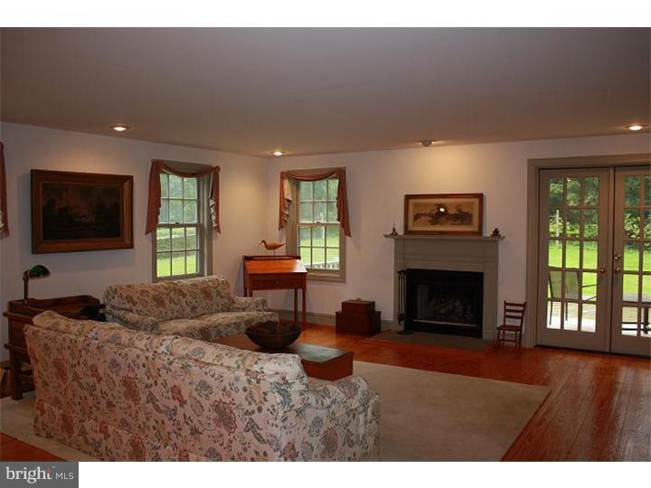 364 East Hillendale Road Kennett Square, PA 19348 - Photo 11 of 17 a living room with furniture a flat screen tv and a fireplace