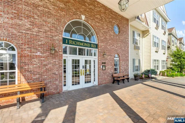 a front view of a house with outdoor seating