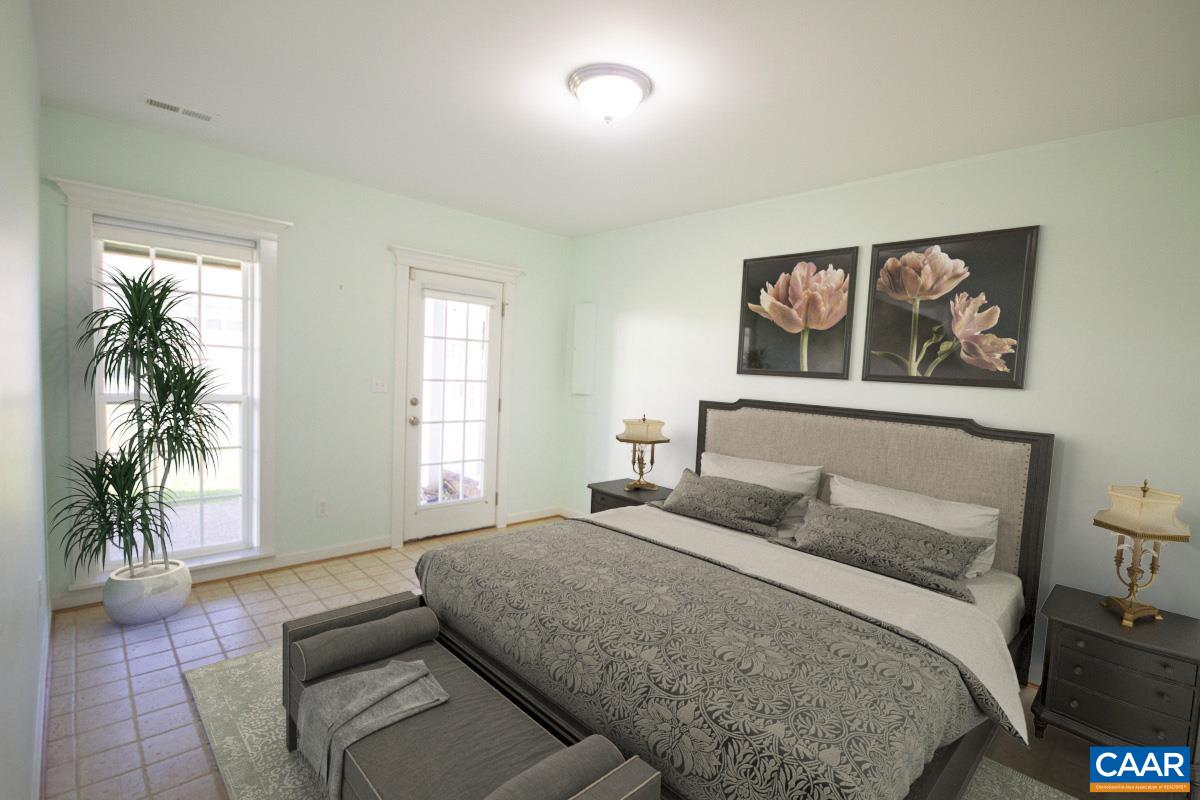 2095 Avinity Loop Charlottesville, VA 22902 - Photo 16 of 42 a bedroom with a bed and a couch