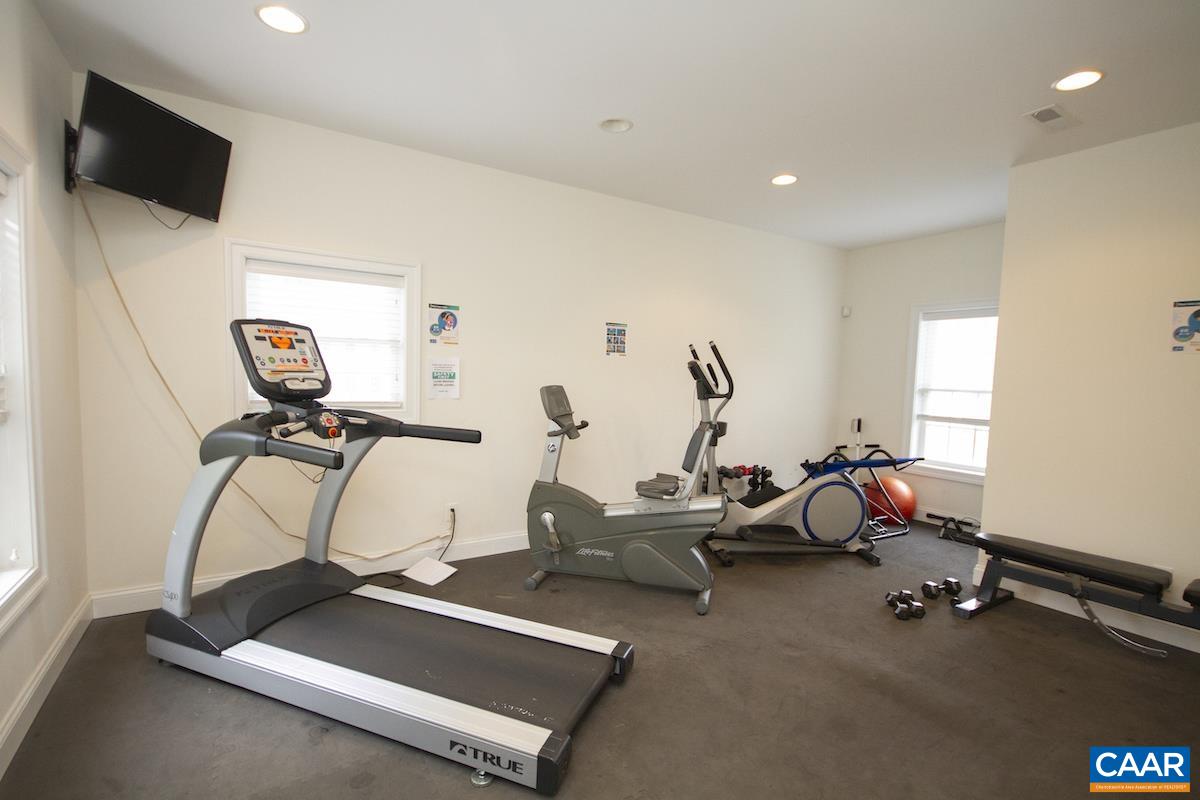 2095 Avinity Loop Charlottesville, VA 22902 - Photo 33 of 42 a room with gym equipment and a flat screen tv
