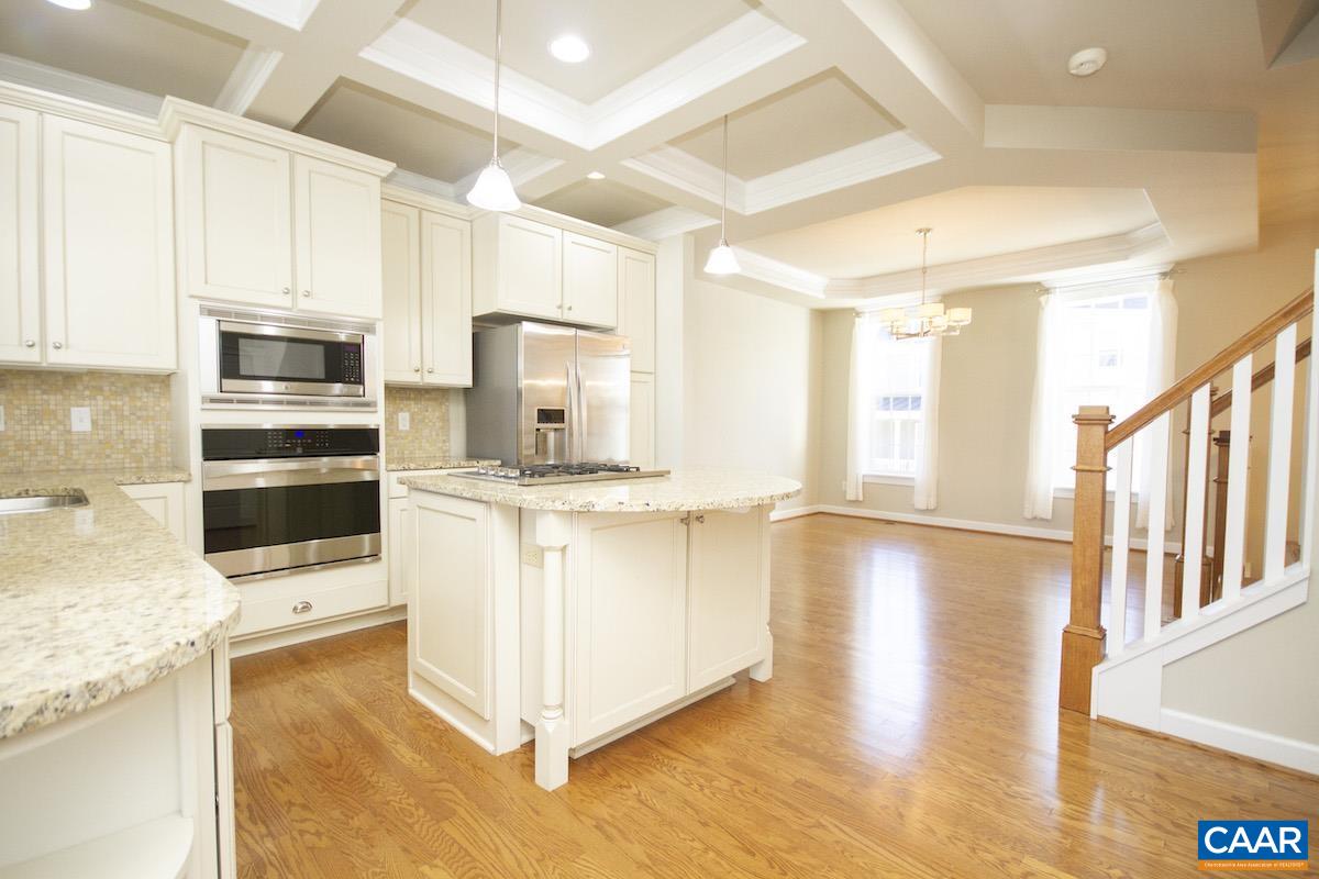 2095 Avinity Loop Charlottesville, VA 22902 - Photo 36 of 42 a kitchen with stainless steel appliances a stove a sink and a refrigerator
