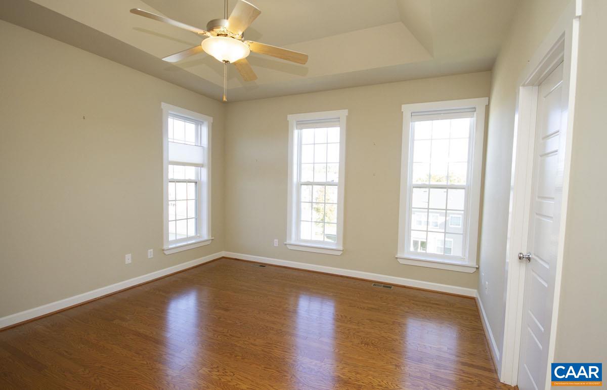 2095 Avinity Loop Charlottesville, VA 22902 - Photo 38 of 42 a view of an empty room with window and wooden floor