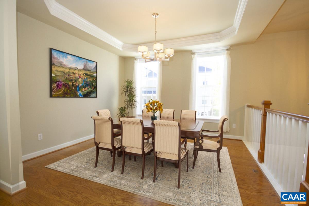 2095 Avinity Loop Charlottesville, VA 22902 - Photo 8 of 42 a view of a dining room with furniture window and wooden floor